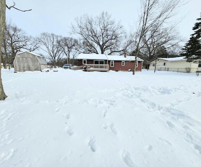 yard layered in snow featuring covered porch