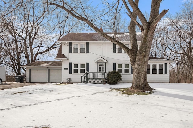 colonial-style house featuring a garage