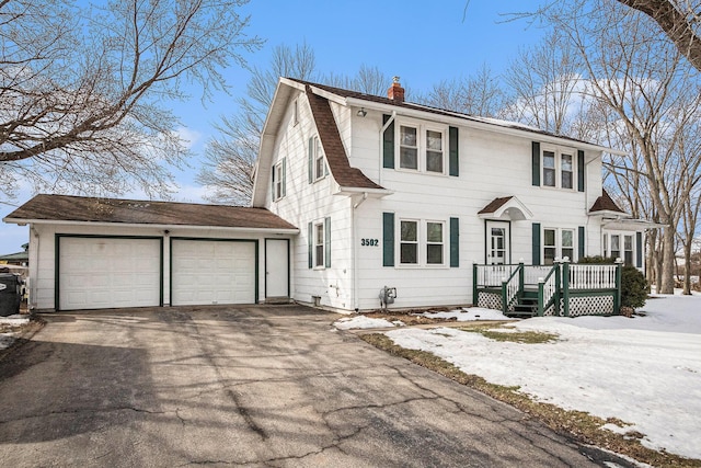 colonial inspired home with a garage