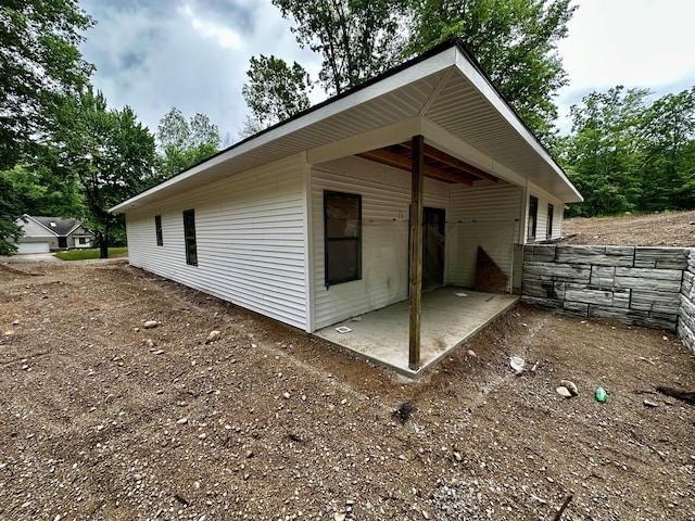 11300 Apache Wells Ct, Stanwood, MI 49346 - view of side of home featuring a patio
