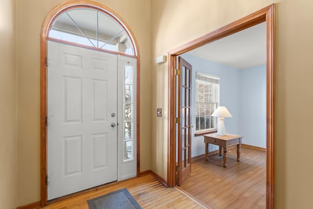 entryway with light hardwood / wood-style flooring