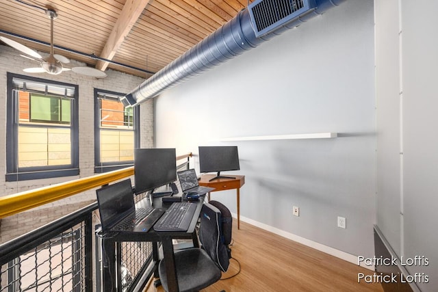 home office with beamed ceiling, brick wall, wood-type flooring, and wooden ceiling