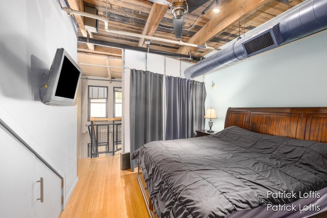 bedroom with light hardwood / wood-style floors