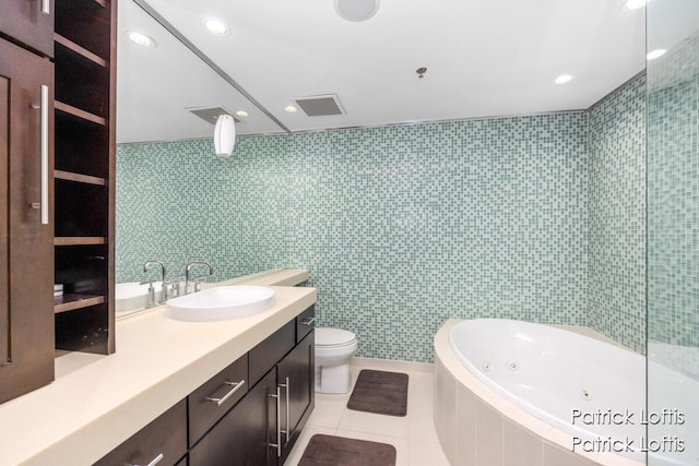 full bathroom featuring plus walk in shower, tile walls, vanity, toilet, and tile patterned floors