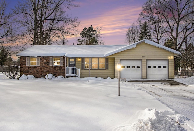 ranch-style house featuring a garage