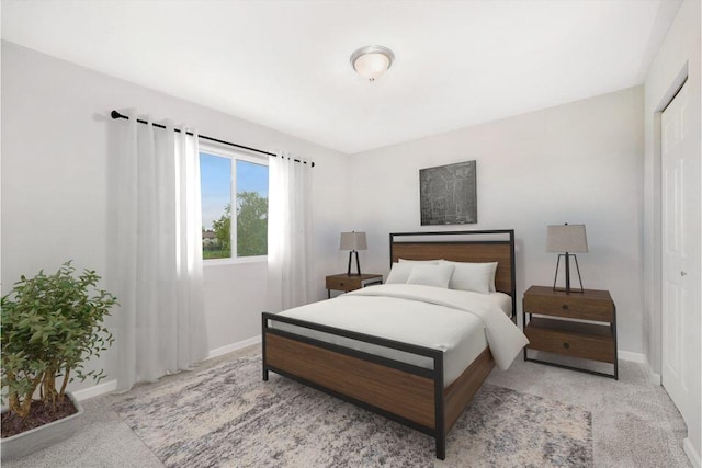 bedroom with light carpet and a closet