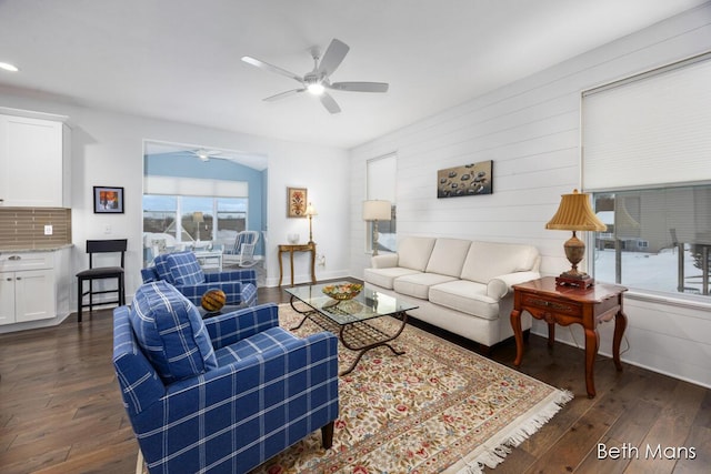 living room with dark hardwood / wood-style flooring, plenty of natural light, and ceiling fan