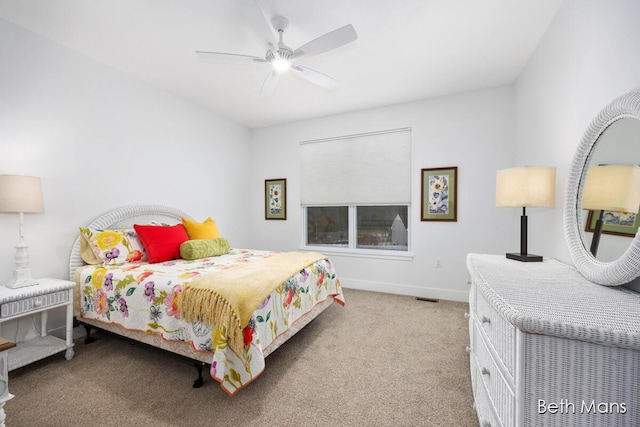 carpeted bedroom with ceiling fan