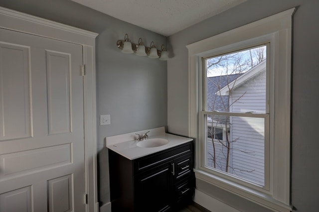 bathroom featuring vanity and a textured ceiling