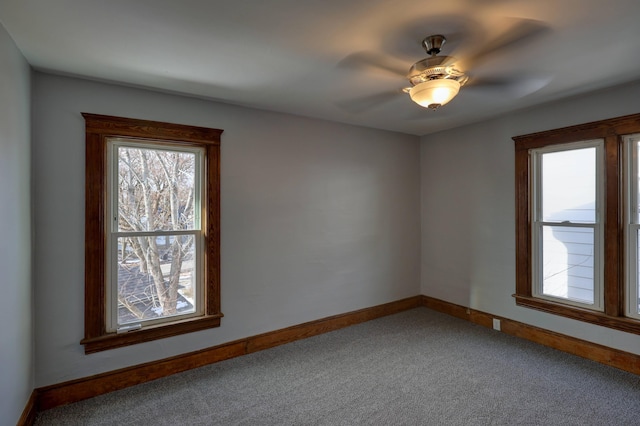 spare room with carpet and ceiling fan