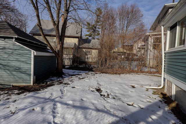 view of yard layered in snow