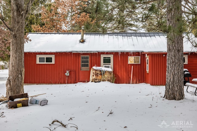 view of snow covered house