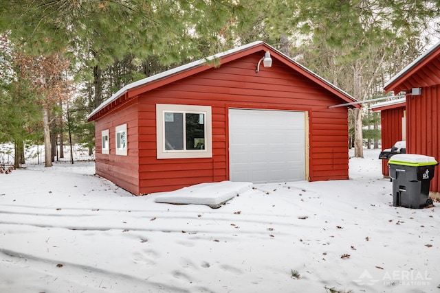 view of snow covered garage