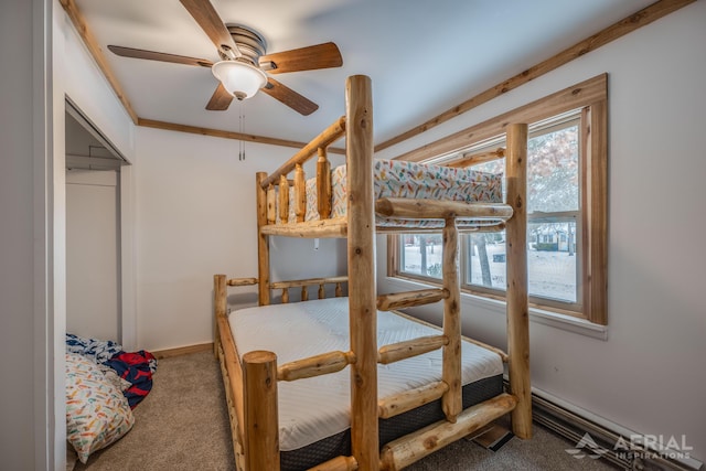 bedroom featuring crown molding, ceiling fan, a baseboard radiator, and carpet floors