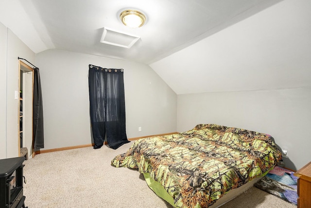 bedroom featuring vaulted ceiling and carpet floors