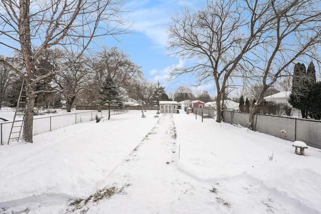 view of yard layered in snow