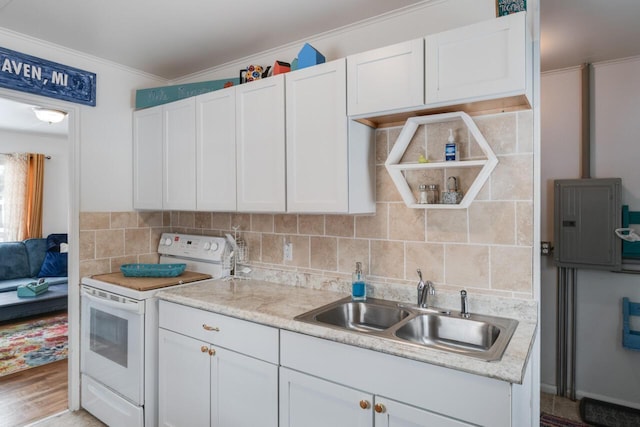 kitchen with electric range, decorative backsplash, and white cabinets