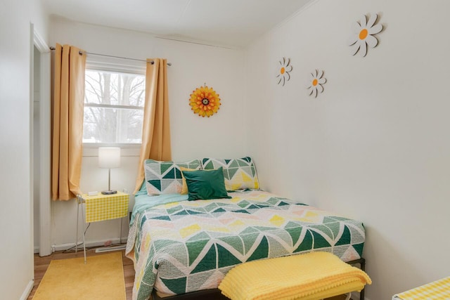 bedroom with hardwood / wood-style floors