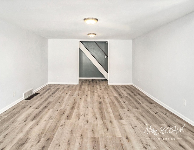 spare room featuring light wood-type flooring