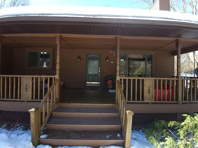 property entrance with covered porch