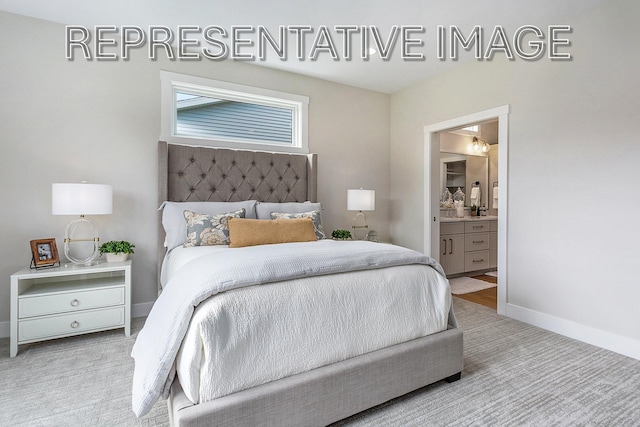 carpeted bedroom with ensuite bath