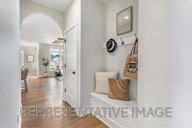 mudroom with wood-type flooring