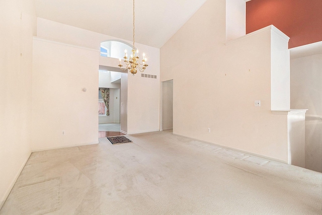 interior space featuring a chandelier and high vaulted ceiling