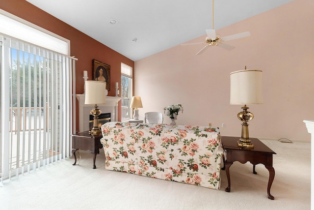 living room with carpet, lofted ceiling, and ceiling fan