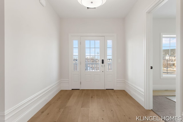 doorway to outside featuring light wood-type flooring