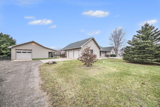 view of front of home with a garage and a front yard