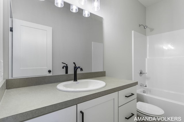 full bathroom with shower / tub combination, vanity, and toilet