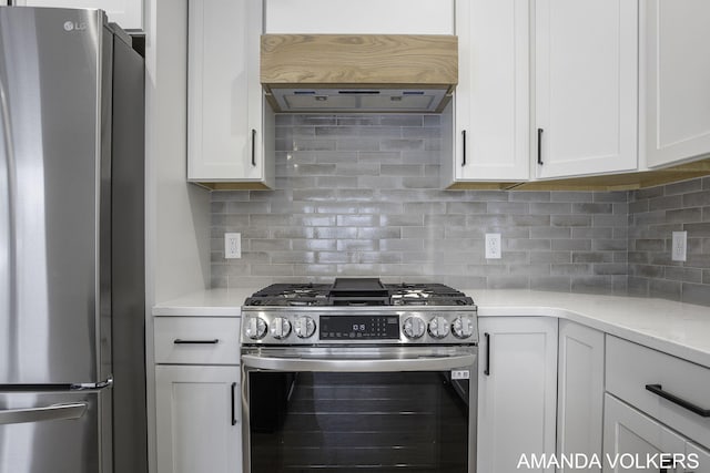 kitchen featuring stainless steel appliances, white cabinetry, tasteful backsplash, and custom range hood