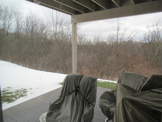 view of snow covered deck