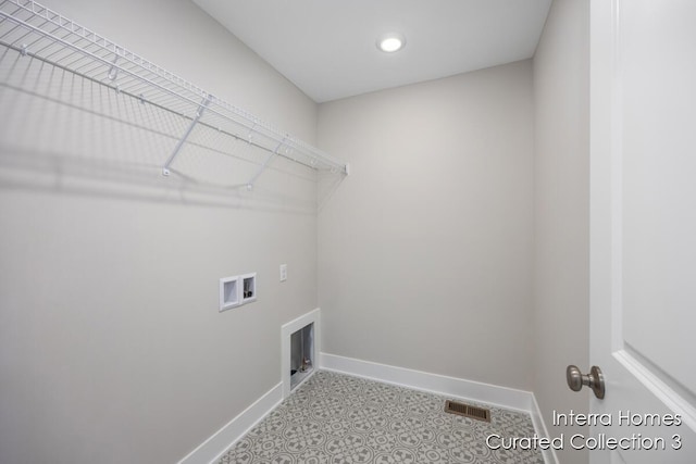 washroom with washer hookup, laundry area, visible vents, and baseboards