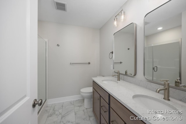 bathroom featuring marble finish floor, baseboards, visible vents, and a sink