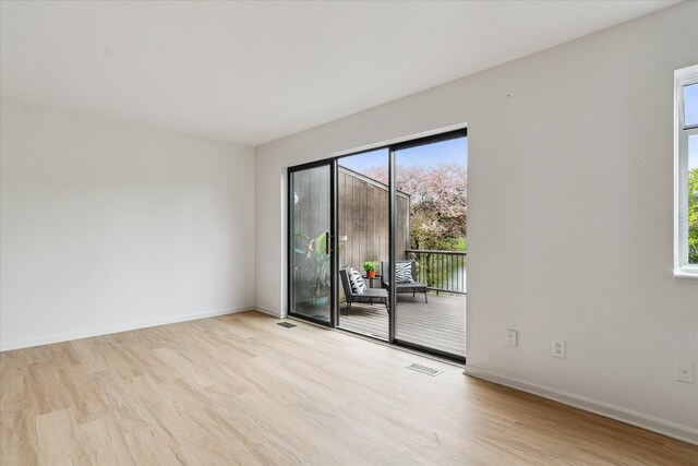 empty room with wood finished floors and baseboards
