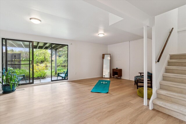 workout room with light wood-style floors