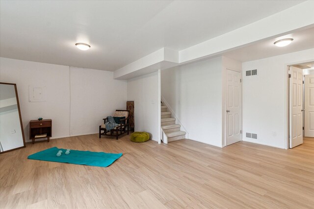 exercise area with light wood-style flooring