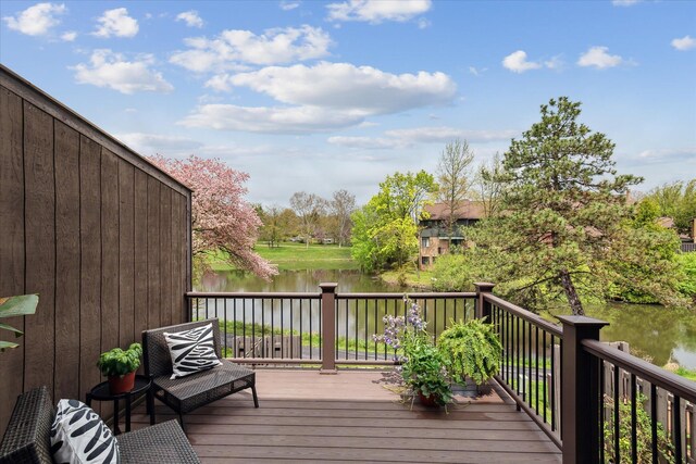 wooden deck with a water view