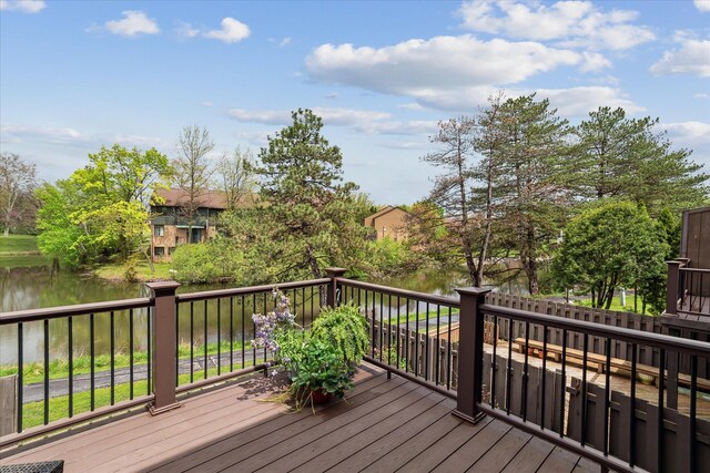 wooden deck featuring a water view