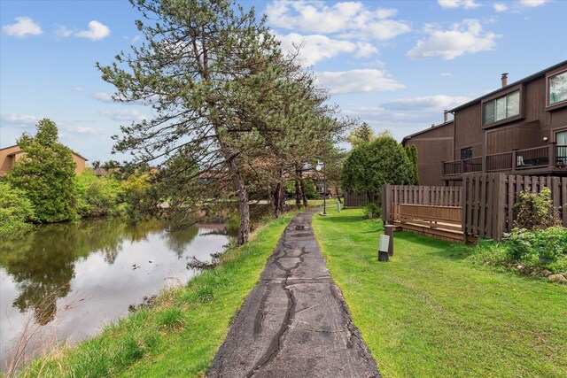view of grassy yard with a water view