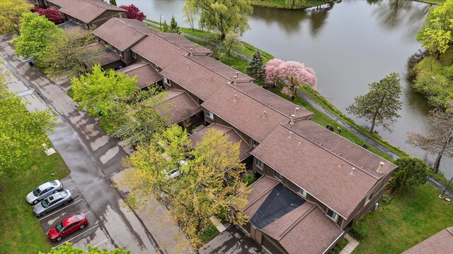 view of subject property with a nearby body of water