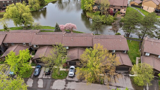 aerial perspective of suburban area featuring a nearby body of water