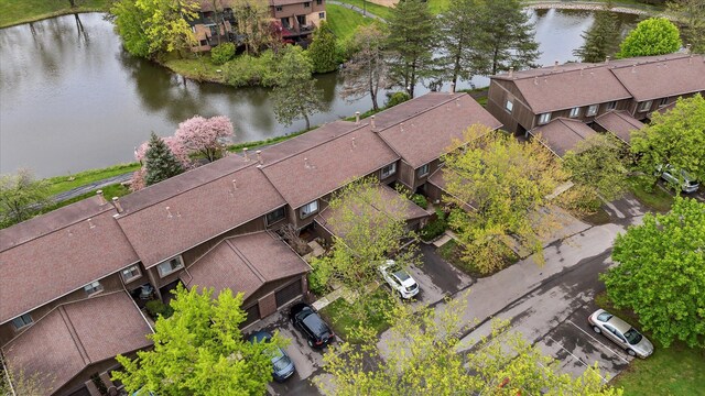 aerial perspective of suburban area with a large body of water