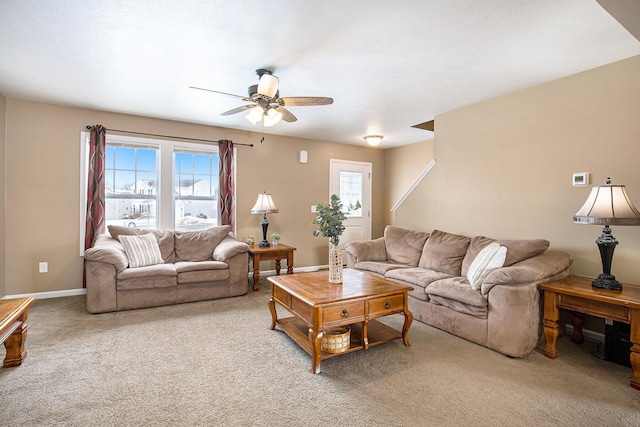 living room with ceiling fan and carpet flooring