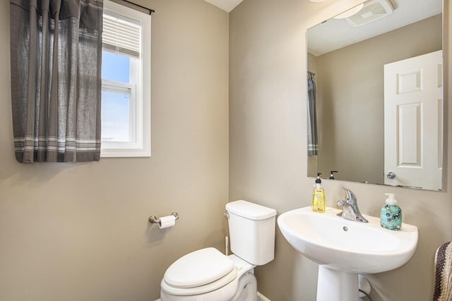 bathroom with toilet and sink