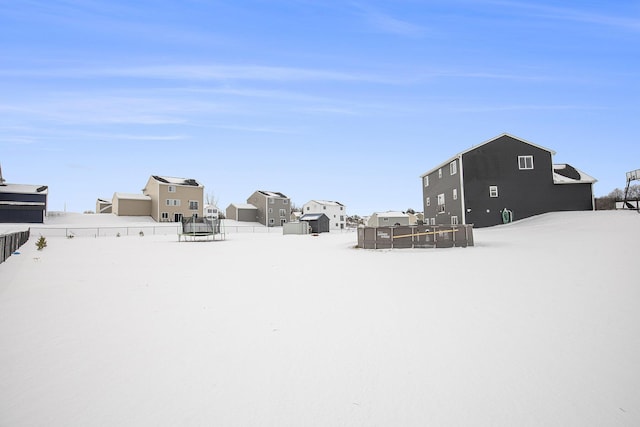 view of yard layered in snow