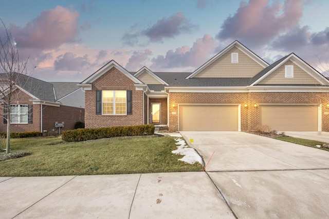 view of front facade featuring a garage and a lawn