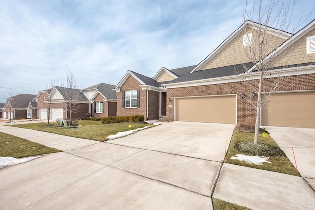 view of front of property featuring a garage and a front lawn