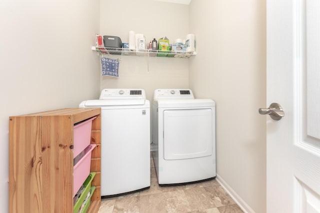 clothes washing area with washer and dryer